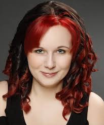 It has black lower hair with fiery red upper section. Long Curly Dark Brunette And Red Two Tone Hairstyle