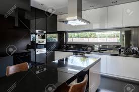 Ratings (422) (23) (168) (14)includes: Modern Black And White Kitchen With Kitchen Island And Dining Table Stock Photo Picture And Royalty Free Image Image 148464502