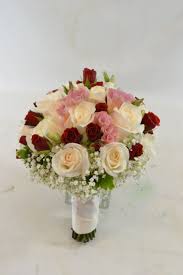 Classic true red creates a warm atmosphere at weddings, full of vibrancy and optimism representative of your own passion and love. Bridal Bouquet With White And Red Roses And Accent With Blush Pink Lisianthus And Baby S Breath Red Rose Bridal Bouquet Flower Bouquet Wedding Bridal Bouquet