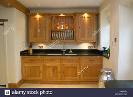 lighting above wooden kitchen cupboards