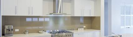 Kitchen featuring a custom stainless hood on book matched soap stone back splash. New Kitchen Design Ideas To Spice Up Your Home By Express Kitchens