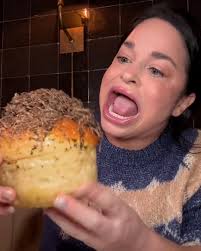 Woman with large mouth gape eating challenge