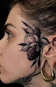 The moon is brightly colored with floral shapes and a single star hangs in the center. 125 Trendy Face Tattoos And Ideas For Men Women Tattoo Me Now