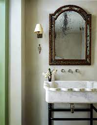 Great half bath that has a simple but luxurious look with the wall paper, mirror and small stand with |. Bathroom Sinks And Vanities House Garden
