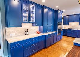 Coordinating colors and wood, black and brass finishes combine eff. Kitchen 64 Gallery Danken Corp