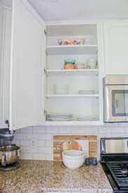 Add style and functionality for a fraction of the cost of installing new cabinets with these tricks. How To Line Your Kitchen Cabinets Easily Kitchen Cabinets Kitchen Shelf Liner Lining Kitchen Cabinets