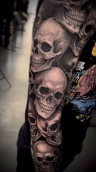 Half Sleeve Skull And Roses Tattoo