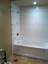 Laying them staggered at half can result in the edges not being flush or even. Complete Re Do Of My 80 Main Bath Let The Demo Begin White Bathroom Tiles Bathroom Shower Walls Bathroom Shower Tile