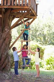 A rope ladder is a vital component of any treehouse or sailing vessel. Group Of Children Climbing Rope Ladder To Treehouse Stock Photo Picture And Royalty Free Image Image 42164586