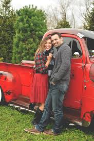 I really do love this picture and what it adds to my. Christmas Engagement Pictures Tree Farm Red Truck Crystal Mooney Photog Christmas Engagement Pictures Christmas Pictures Outfits Christmas Photos Outfits