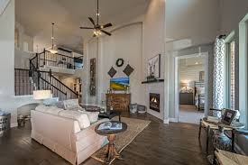 Soaring Ceilings And An Open Concept Living Space For Your Family Time Together All The Perfect Finishes For That Farmhouse Look Home Miller Homes Family Room