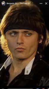 Larry and you should have seen him before the face lift. (Talk about a  Danny Devito look-a-like. I'm glad he's happier now. He really used to  scare the children when he drove