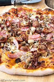 Homemade thin crust pizza, topped off with two types of cheese, bacon, ham, pepperoni and hot sausage! Meat Lover S Pizza A Family Feast