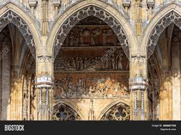 Gothic church facade with steeples and decorated wooden door in front of small square, in a sunny. Ulm Minster Cathedral Image Photo Free Trial Bigstock