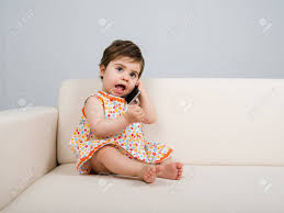 Expressive Baby Talking By Phone Stock Photo Picture And Royalty Free Image Image 71978051