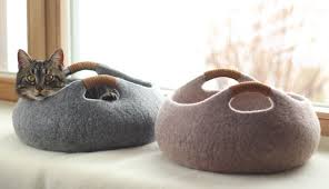 This thick faux fur mat easily converts to a cozy bed by simply buttoning the sides together. Elevele Felted Wool Cat Beds Seamlessly Blend With Modern Home Decor