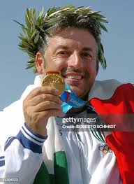 Andrea Benelli of Italy shows his gold medal for winning the Men's... News  Photo