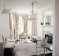 If you are into casual dining, add a table and woven armchairs in front of your gigantic window. Bay Window Curtains French Living Room Leo Designs Chicago