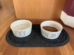 These dishes have distinctive designs and textures to give your hound some extra stimuli when eating. Water Trapper Dog Bowl Mat Orvis