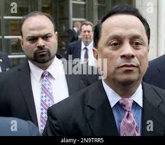 Pedro Espada Jr, right, and his son Pedro Gautier Espada, left, leave a  courthouse in New York, Monday, May 14, 2012. Pedro Espada Jr, the New York  politician accused of looting money