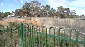 'what draws visitors to the whispering. The Whispering Wall Of The Barossa Reservoir And Its Amazing Parabola Sound Effect