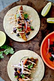 You can really use any fish to make these including salmon. Bakeaholic Mama Haddock Tacos With Sriracha Yogurt Sauce Yummy Food Haddock Recipes Yogurt Sauce
