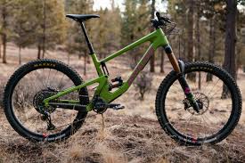 Adjustable geometry on the rear shock mount flips between low and high geometry settings. First Ride Report The New Santa Cruz Nomad V5 The Loam Wolf