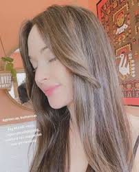 Light brown hair looks flirty and flattering in a very natural way! Kacey Musgraves Debuts Light Brown Hair With Highlights Kacey Musgraves S Hairstyles Instyle
