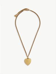 A locket is a pendant that opens to reveal a space used for storing a photograph or other small item such as a lock of hair. Balenciaga Heart Locket Necklace In Antique Gold Metallic For Men Lyst