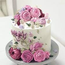 Buttercream flowers in pretty pastels create a garden of sweetness on this cake that's perfect for bridal showers, weddings, easter or mother's day. From Amelialinoo Cake Made In The Class In Goiania Go Palette Knife Flowers Relieves T Floral Cake Birthday Cake With Flowers Flower Cake