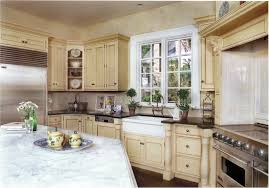 Cream Kitchen Cabinets With White Marble Countertops And Island The Stainless Stee White Marble Countertops Traditional Kitchen Design Custom Kitchen Cabinets
