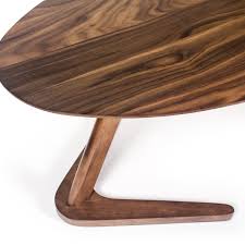 This walnut coffee table is visually pleasing and allows you to eat, drink, or work at a comfortable level by raising the tabletop's three different sections. Boomerang Coffee Table