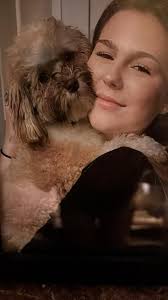 This is a picture of Rosco as a puppy about 6 months old with my  granddaughter.