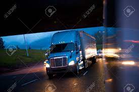If you worry about your truck equipment safety, there is a good chance that you worry about the brakes, tires, and semi truck parts mechanical parts. Blue Semi Truck In The Reflection Of The Evening Headlights Lights Stock Photo Picture And Royalty Free Image Image 58825537