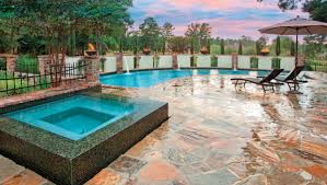The stone cave and waterfall on the far end of this pool make for an amazing feature in this backyard water park. Cool Backyard Pools