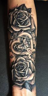 The petals of the rose are inked a deep red while the leaves and stems are inked in black. Girl Arm Tattoos Roses Arm Tattoo Sites