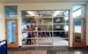 Gdu installed several glass garage doors for an apartment complex in north park, san diego and were used for dividing the living room space with the outdoor patio area. A Garage Door Is Being Daviess County Public Library Facebook