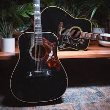 Gibson Black Acoustic Electric Guitar A Pair Of Songbirds From Our Ceo S Personal Collection Chicagomusicexchange Gibson Dove Hum In 2020 Black Acoustic Guitar Acoustic Guitar Gibson Acoustic