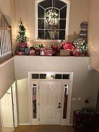 Set these holiday backdrops on a wall to set the perfect theme or to use as a christmas photo backdrop. Foyer Ledge Christmas Decorations With Red Tractor And Christmas Trees Cozychristmasdecor Christmas Foyer Decor Christmas Wall Decor Foyer Decorating