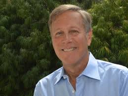 Who was the priest who helped raise J. R. R. Tolkien?