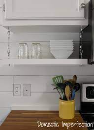 To put up a shelf in a cupboard. How To Raise Your Kitchen Cabinets To The Ceiling Domestic Imperfection