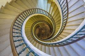 In this example, the floating spiral staircase is made from wood, and also has railings with decorative metal designs on the sides. Triple Spiral Staircase Of Floating Stairs Convent Of Santo Domingo De Bonaval Photographic Print Peter Adams Art Com