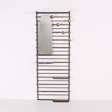 Freestanding rack is made to design a tree branch. French Modernist Brass Steel Coat Rack With Mirror 94640