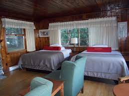 Log furniture and quilts adorn the rooms and cabins, some of which have water views. Lake Crescent Lodge Historic Olympic Getaway Milesgeek