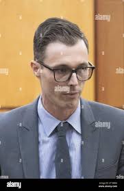 Defense attorney Mark Conrad heads for a seat at the trial of Tacoma Police  Officers Christopher Burbank, Timothy Rankine and Matthew Collins for the  March 2020 death of Manuel Ellis in Pierce