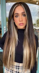 Dark brown hair and balayage highlights complement each other beautifully, as evidenced by this gorgeous hair color choice. Best Hair Colours To Look Younger Blonde Highlights Face Framing