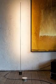 Minimalist Lighting At Its Best Catellani Smith Light Stick Led Floor Lamp Floor Lamp Lamp Stick this lamp in a modern dining room, where it will complement a glass table and sleek round stools.
