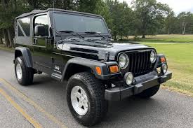 Image result for Brilliant Black 2005 Jeep