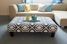 Beige bottoms with white cushions on chairs and matching square ottoman, featuring removable dark wood table surface. Diy Rug Ottoman