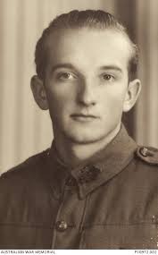 Studio portrait of NX37547 Gunner (Gnr) Alan Malcolm Fox, 18 Anti Tank  Battery. An accountant in ...